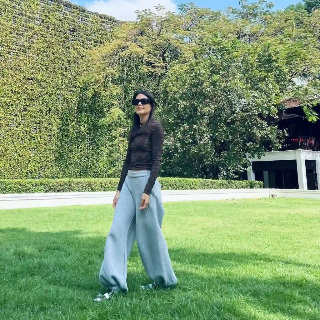 Sheer Black Top with Oversized Sweatpants and Birkenstocks