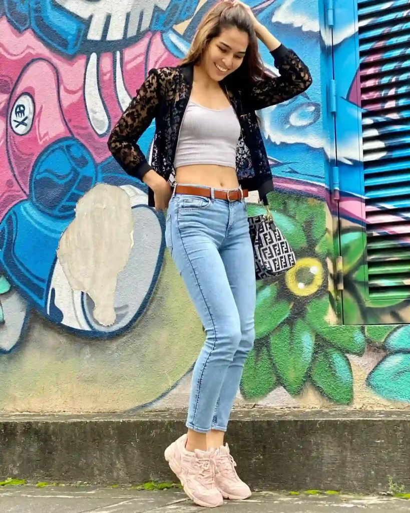 Black Lace Jacket with Light Jeans and Pink New Balance Shoes