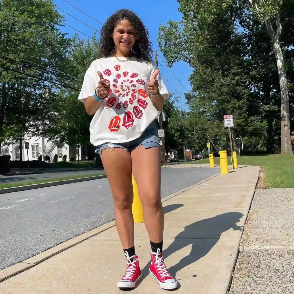 Graphic White Tee with Denim Shorts and Red Converse