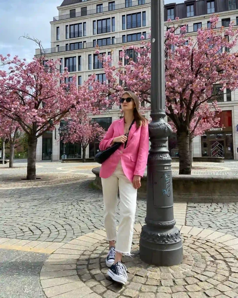 Pink Blazer with White Jeans and Sneakers Outfit