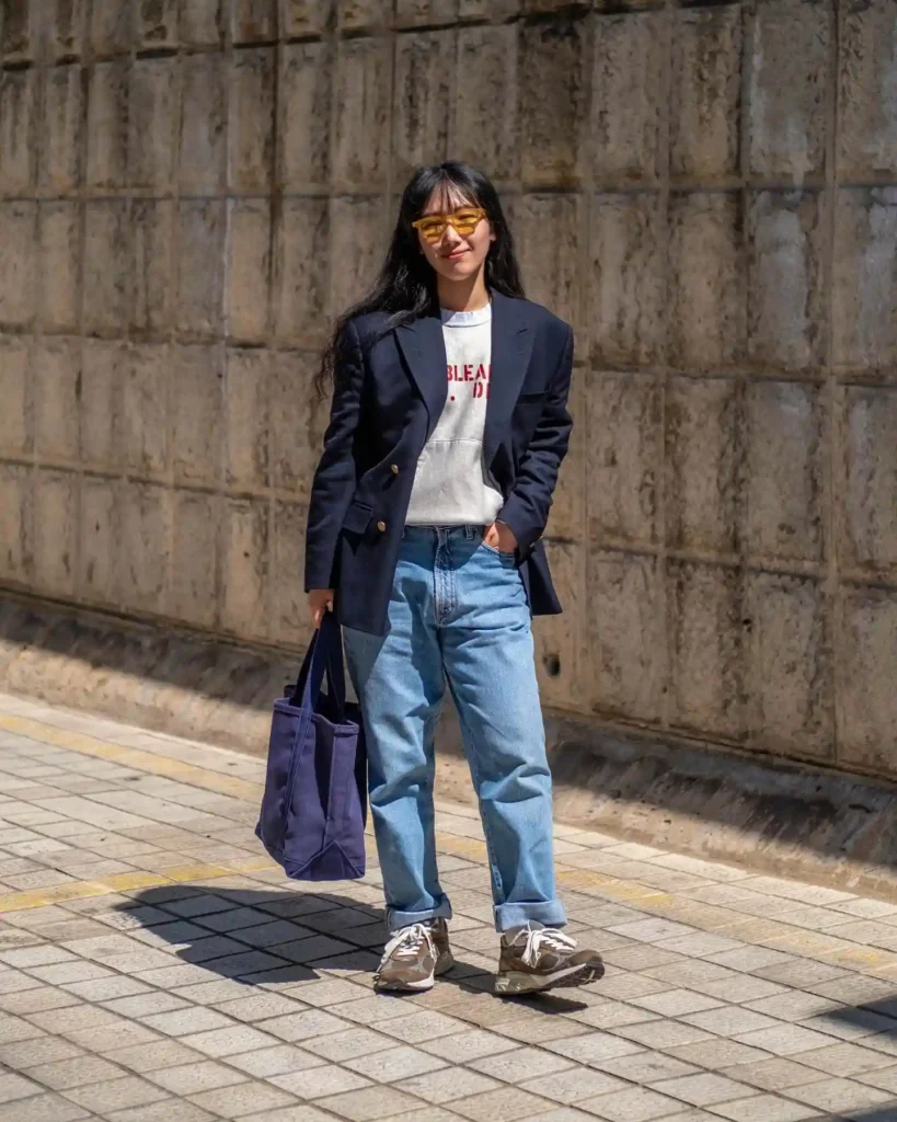 Navy Blazer with Graphic Sweatshirt and Loose Jeans Outfit