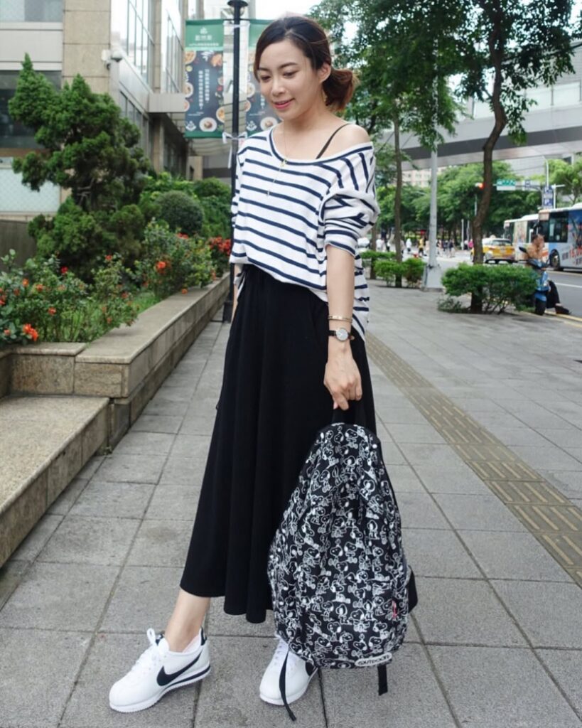 Striped Off-Shoulder Top with Black Skirt and Nike Cortez