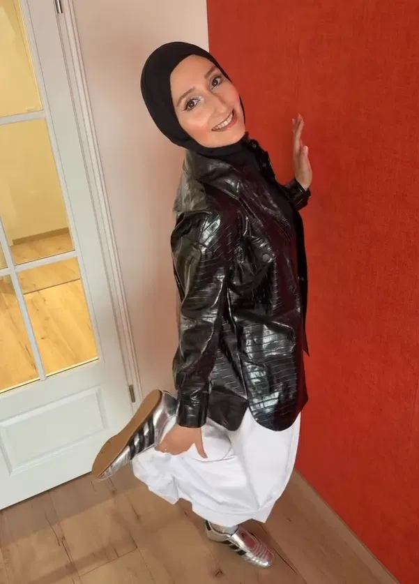 Black Leather Jacket with White Skirt and Silver Adidas Taekwondo
