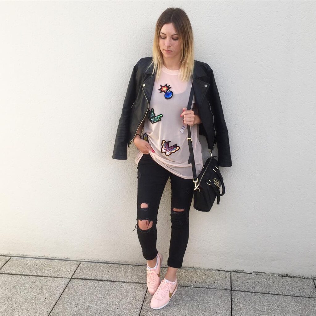 Leather Jacket with Ripped Jeans and Pink Nike Cortez