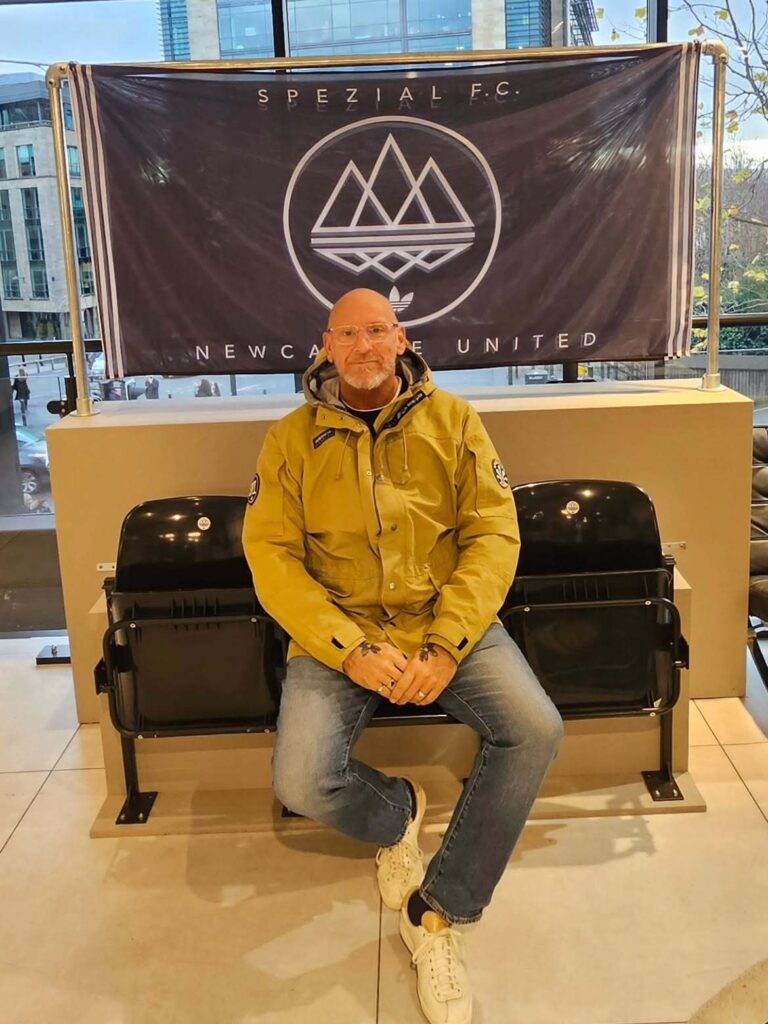 Yellow Parka Jacket with Faded Jeans and Cream Adidas Spezial