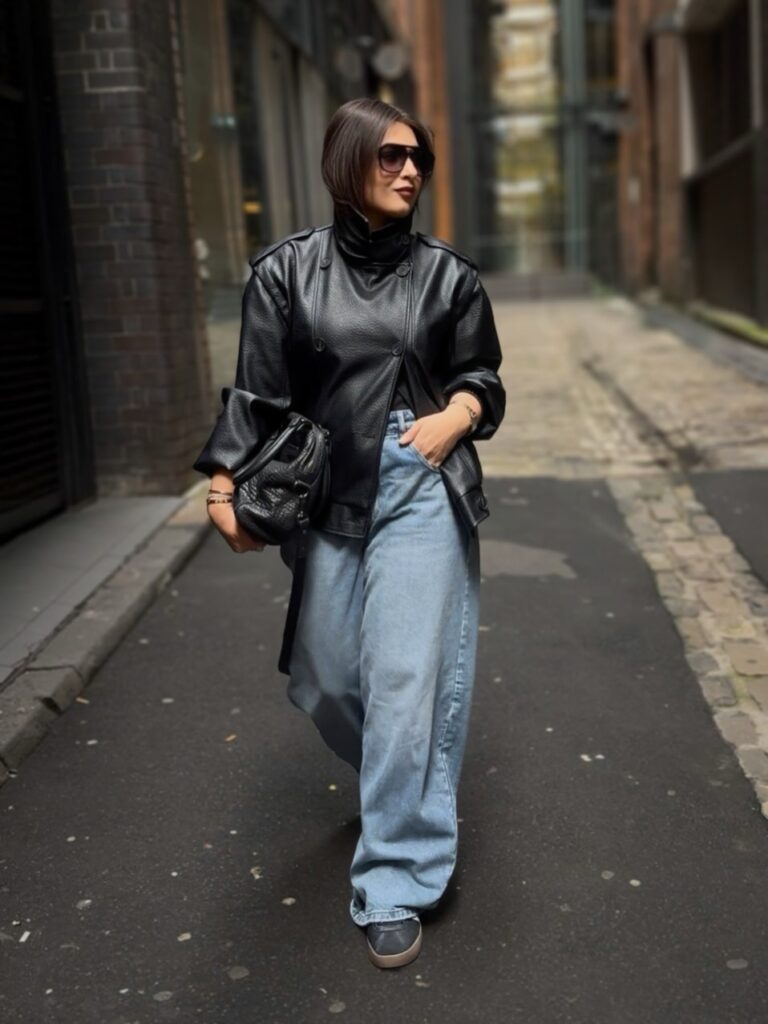 Longline Black Leather Coat with Baggy Jeans and Sneakers