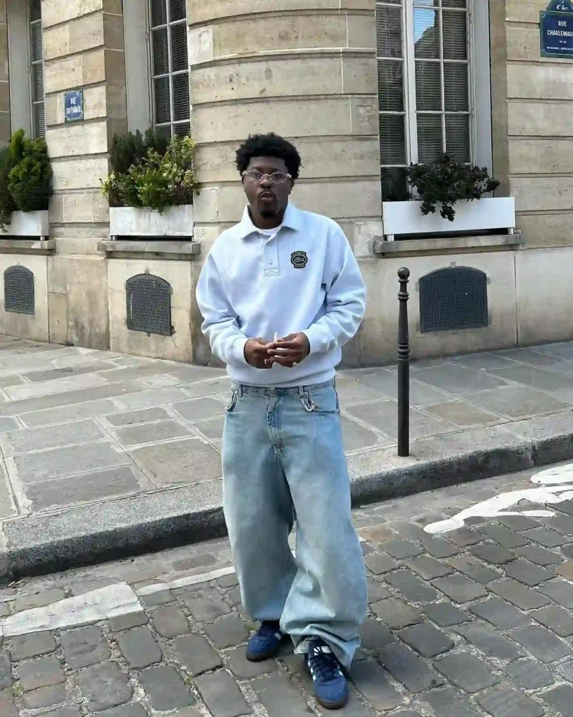 White Polo Sweatshirt with Light Wash Baggy Jeans and Navy Adidas Spezial