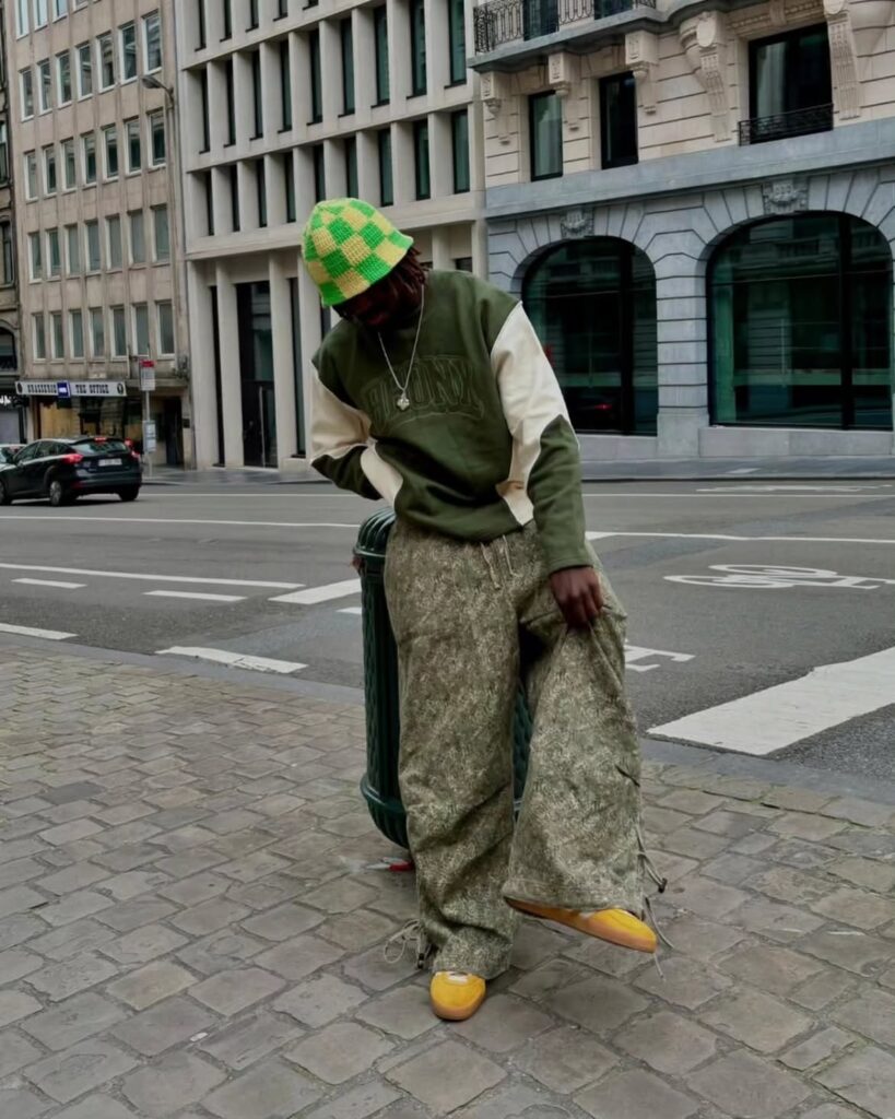 Green Varsity Sweatshirt with Camo Pants and Yellow Adidas Spezial