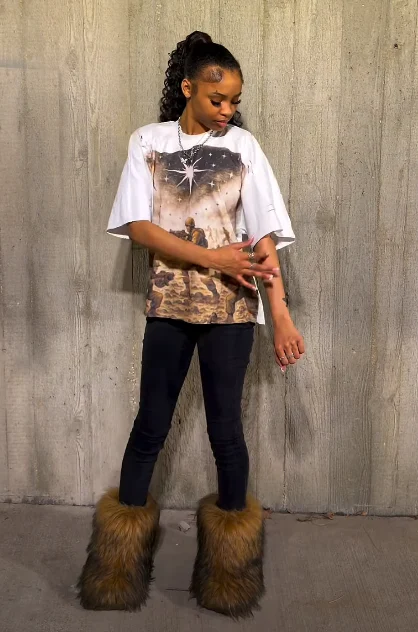 Oversized Graphic Tee with Skinny Jeans and Fur Boots