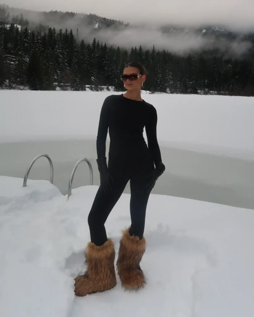 All-Black Catsuit with Brown Furry Boots Winter Outfit