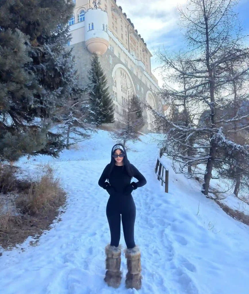 All-Black Snow Fit with Tall Brown Fur Boots