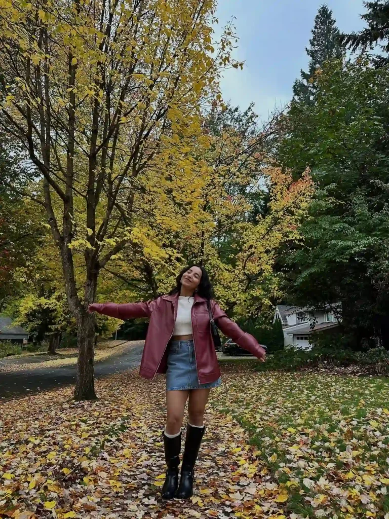 Burgundy Leather Jacket with Denim Skirt and Black Knee High Boots