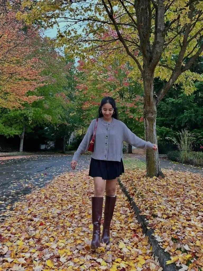 Grey Cardigan with Black Pleated Skirt and Brown Knee High Boots