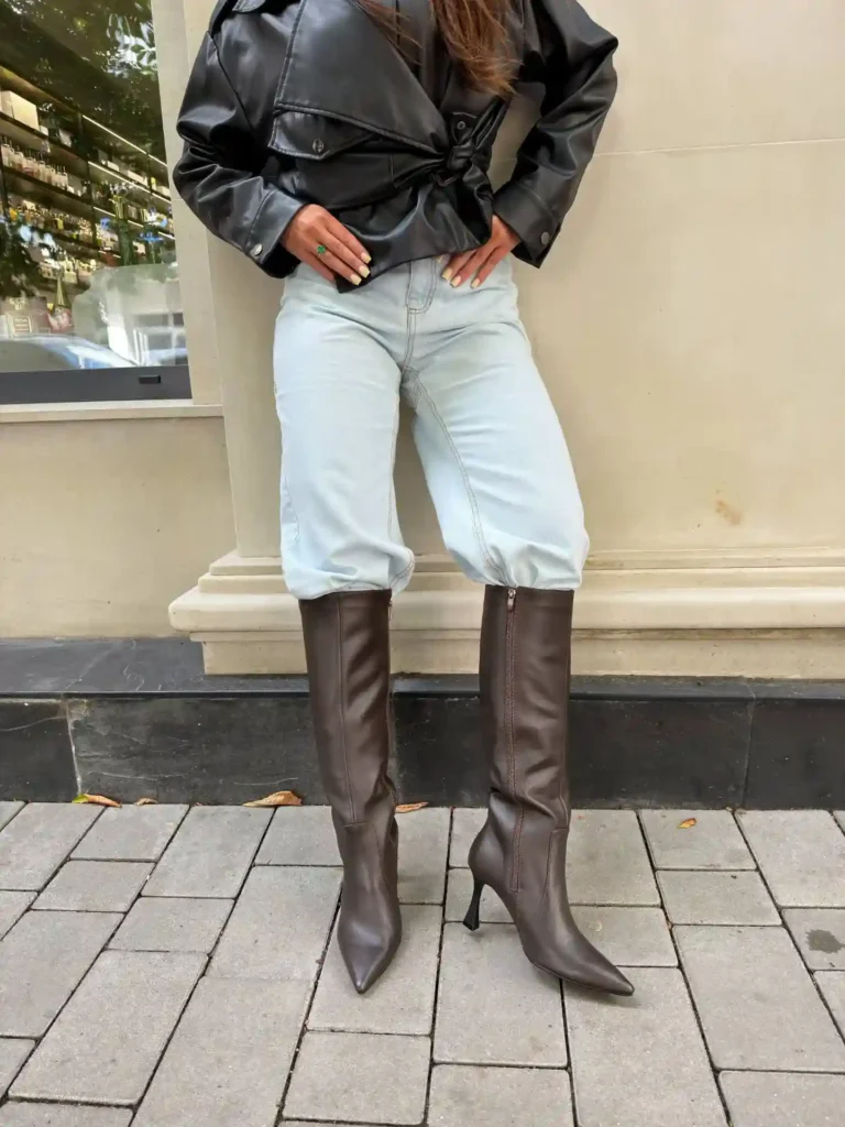 Leather Jacket with Brown Knee High Boots and Barrel-Leg Jeans Outfit