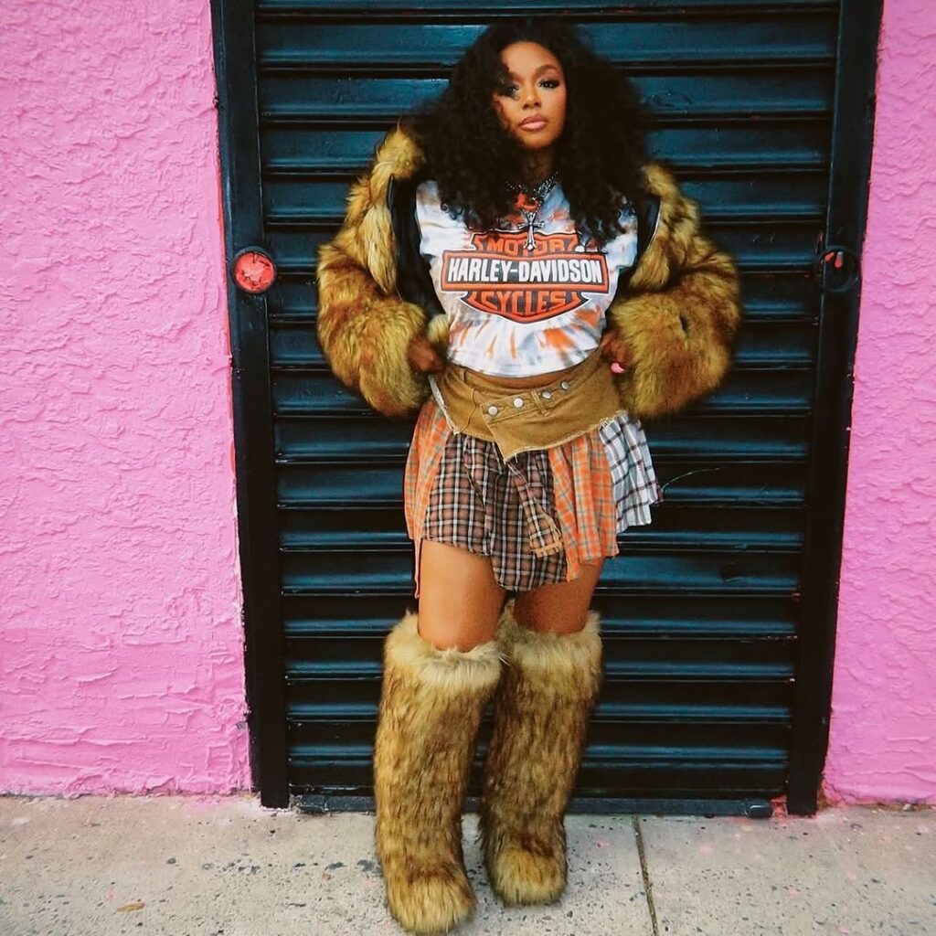Graphic Tee with Layered Skirt and Knee-High Fur Boots