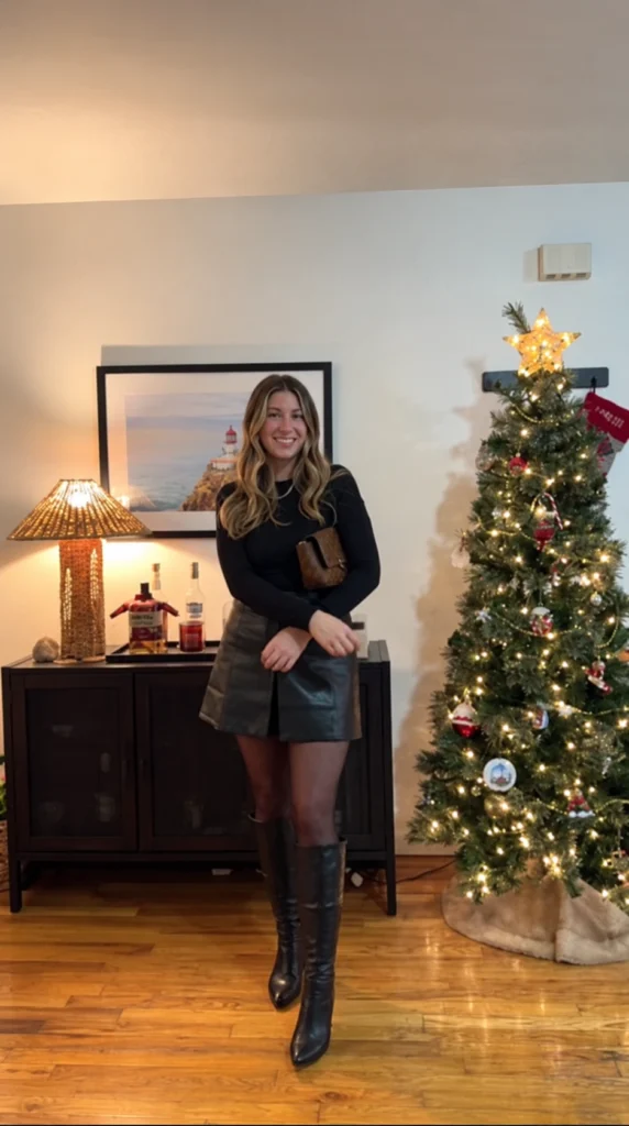 Black Top and Leather Mini Skirt with Knee-High Boots