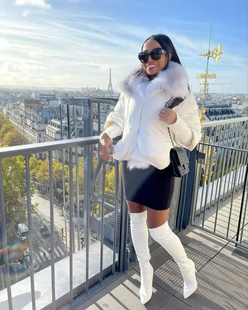 Fur-Hood Puffer and Leather Skirt with White Thigh-High Boots