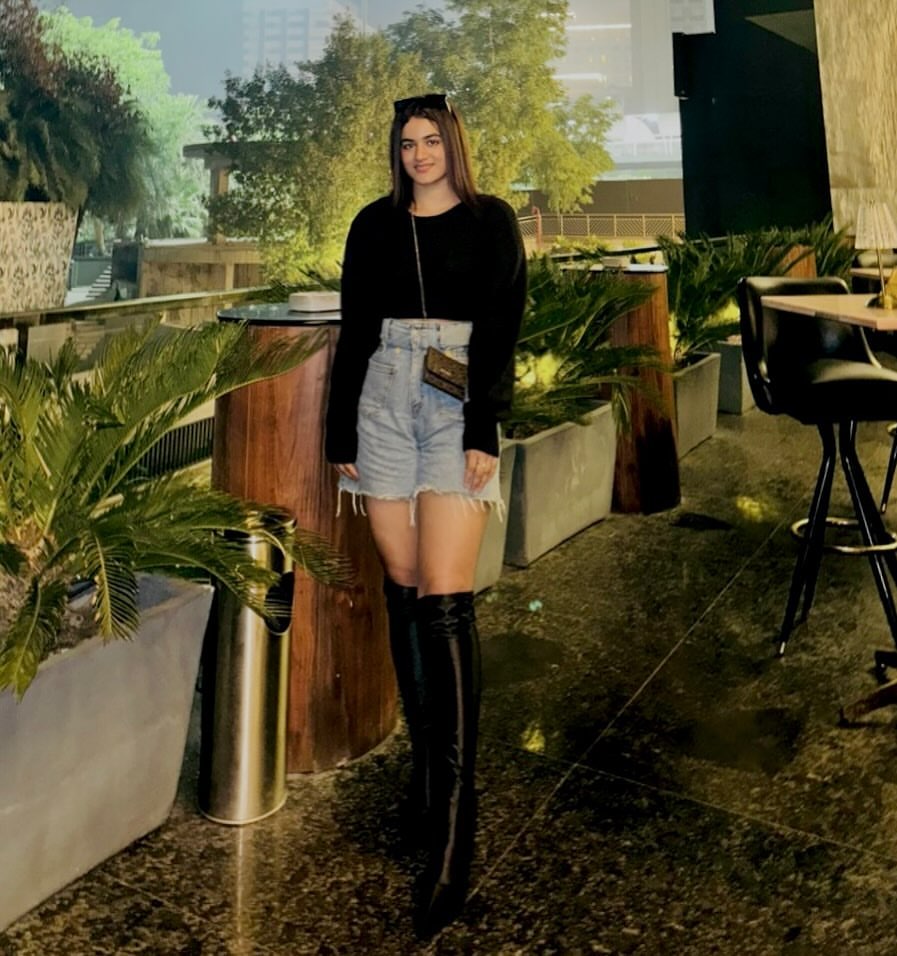 Black Top with Denim Shorts and Over-the-Knee Boots