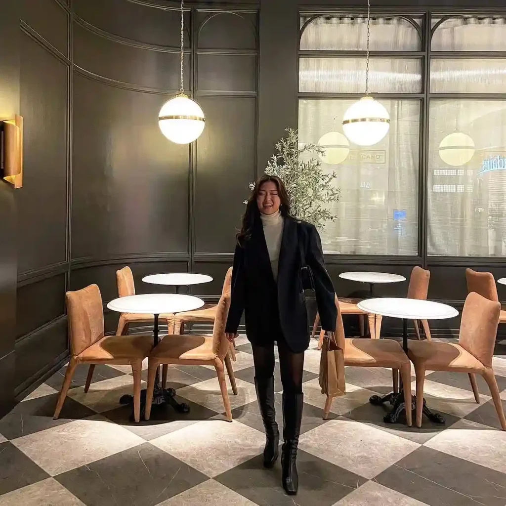 Oversized Black Blazer with White Turtleneck and Knee High Boots