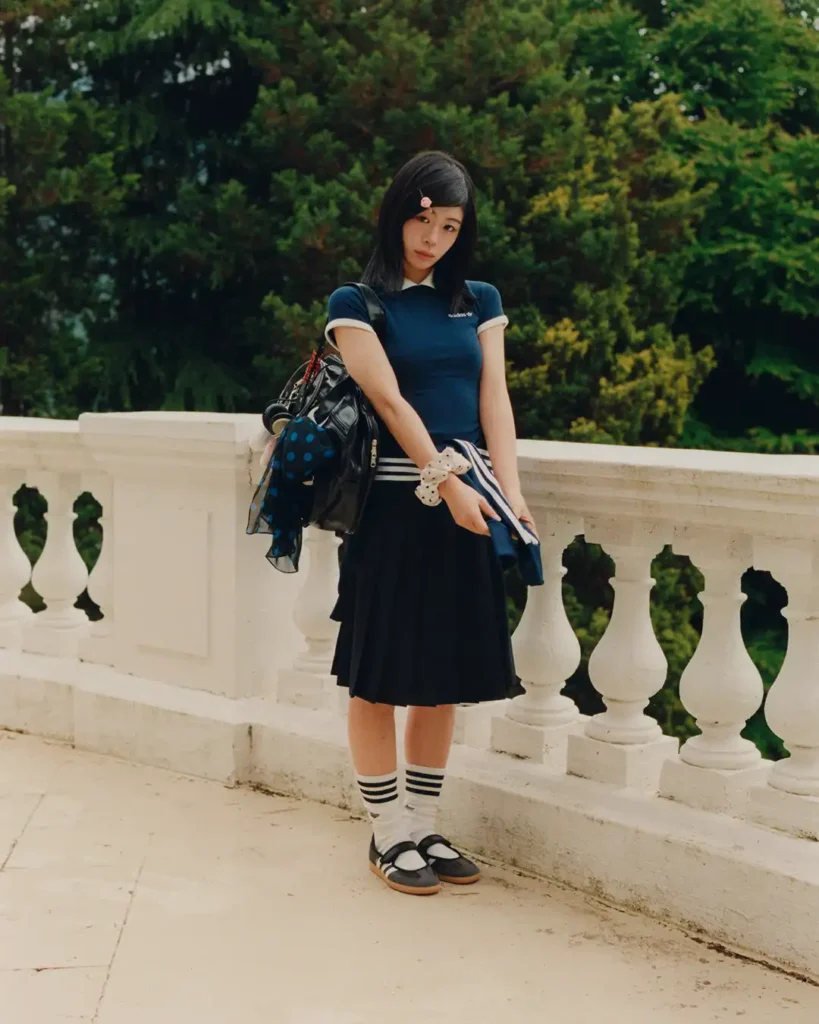 Navy Tee with Black Pleated Skirt and Adidas Samba Jane