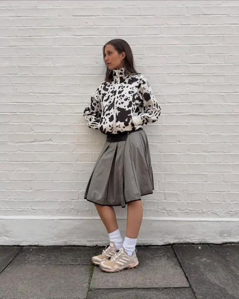 Cow-Print Jacket and Pleated Skirt with Trail Sneakers