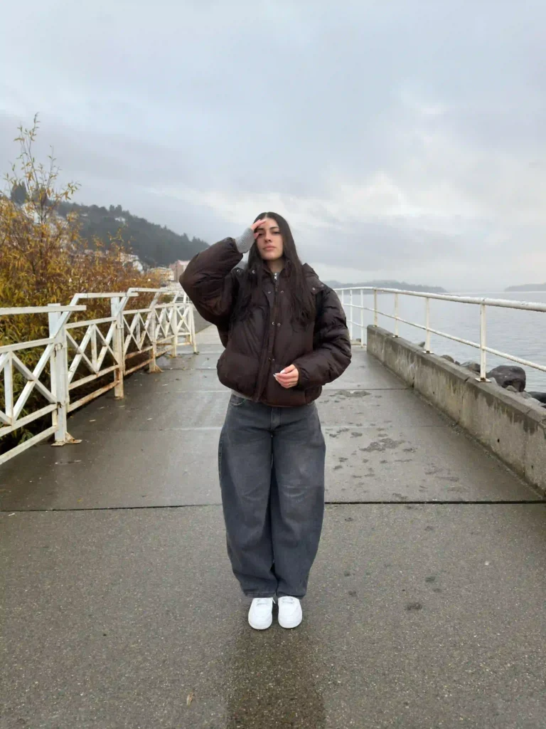 Brown Puffer Jacket and Baggy Grey Jeans with White Sneakers