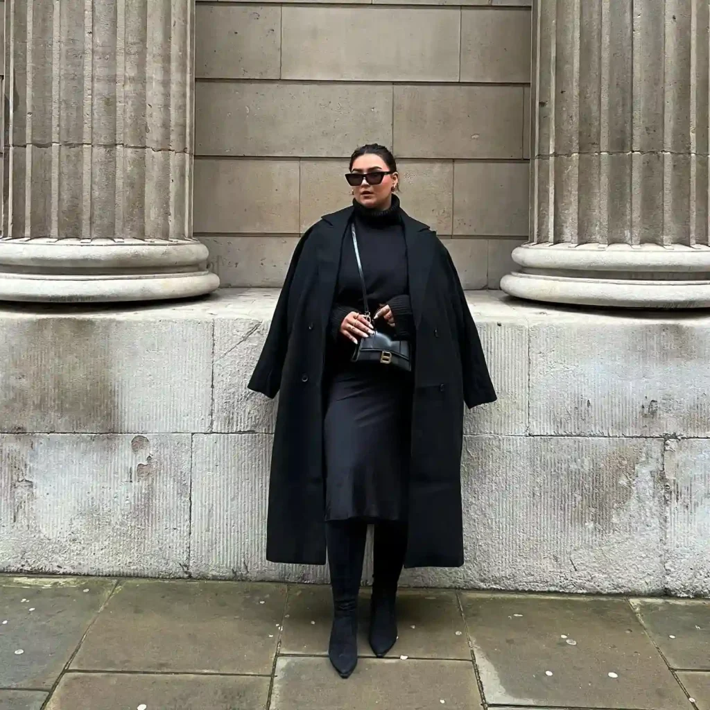 All-Black Longline Coat and Slip Skirt with Black Boots
