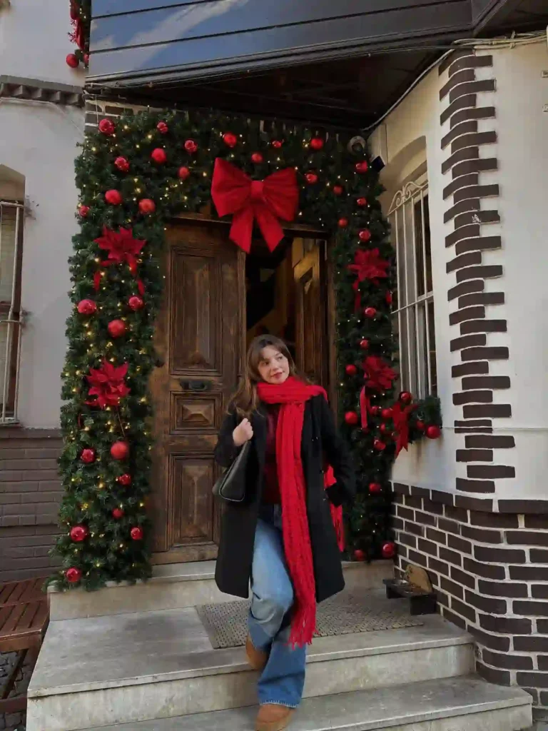 Black Coat with Red Scarf and Tan Uggs