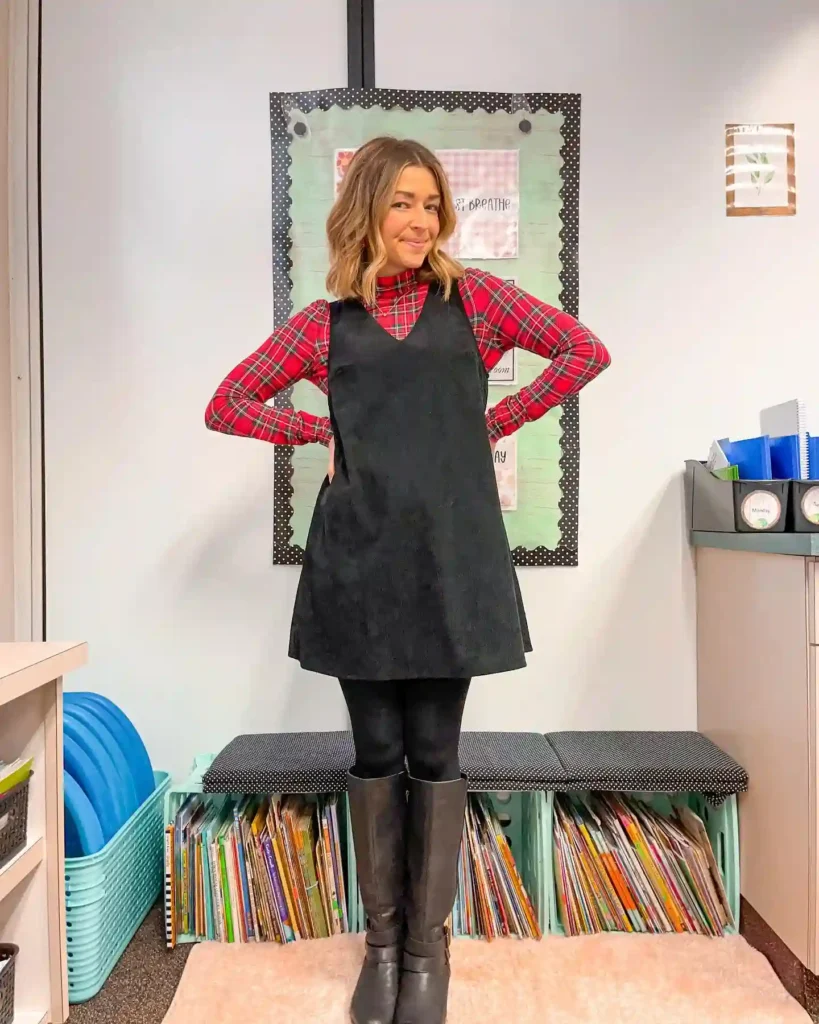 Plaid Turtleneck under a Black Pinafore with Riding Boots