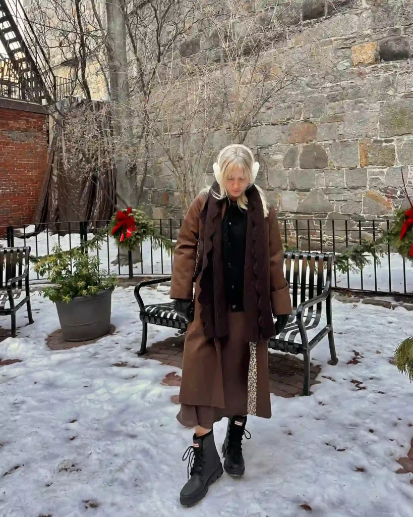 Brown Coat and Black Hunter Boots for a Snowy Winter Day