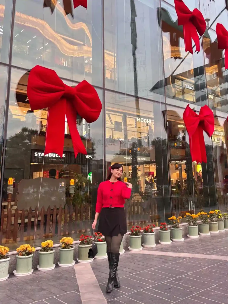 Red Bow Cardigan with Black Skirt and Tall Boots