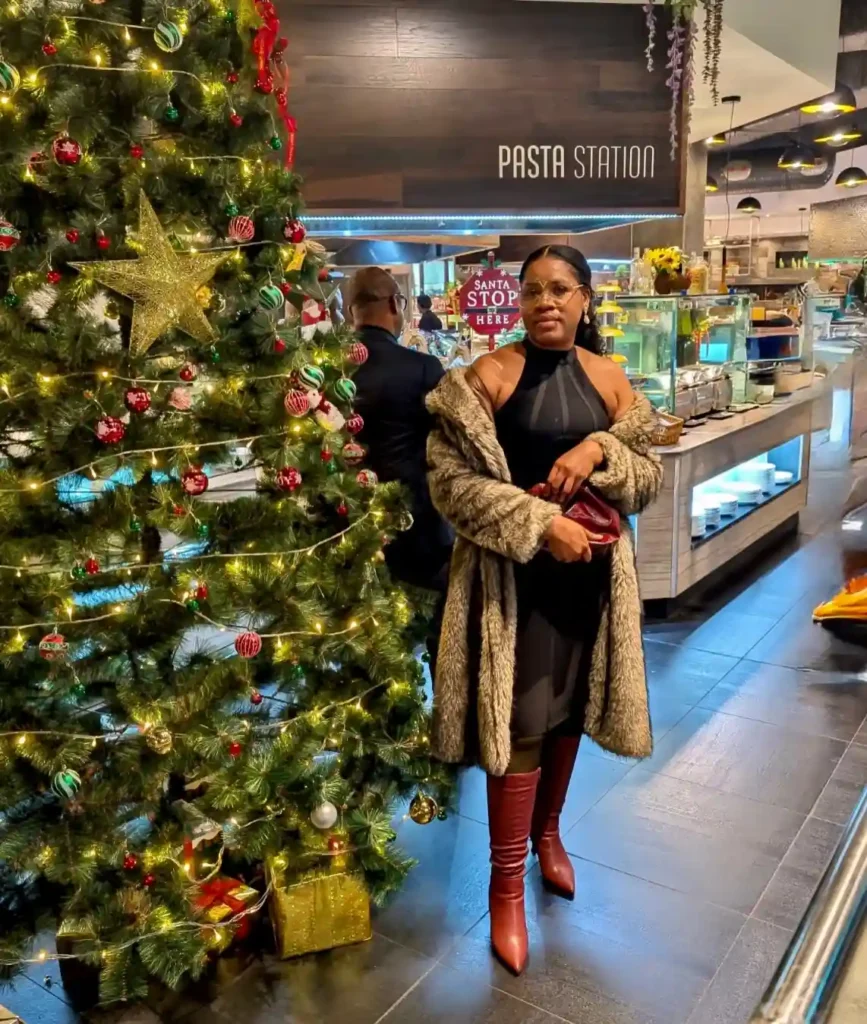 Black Halter Dress and Faux Fur Coat with Red Boots