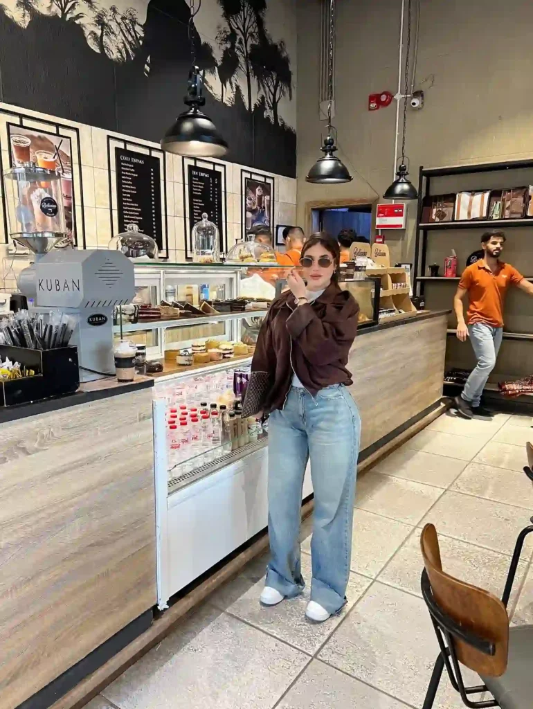 Brown Bomber Jacket and Baggy Jeans with White Sneakers