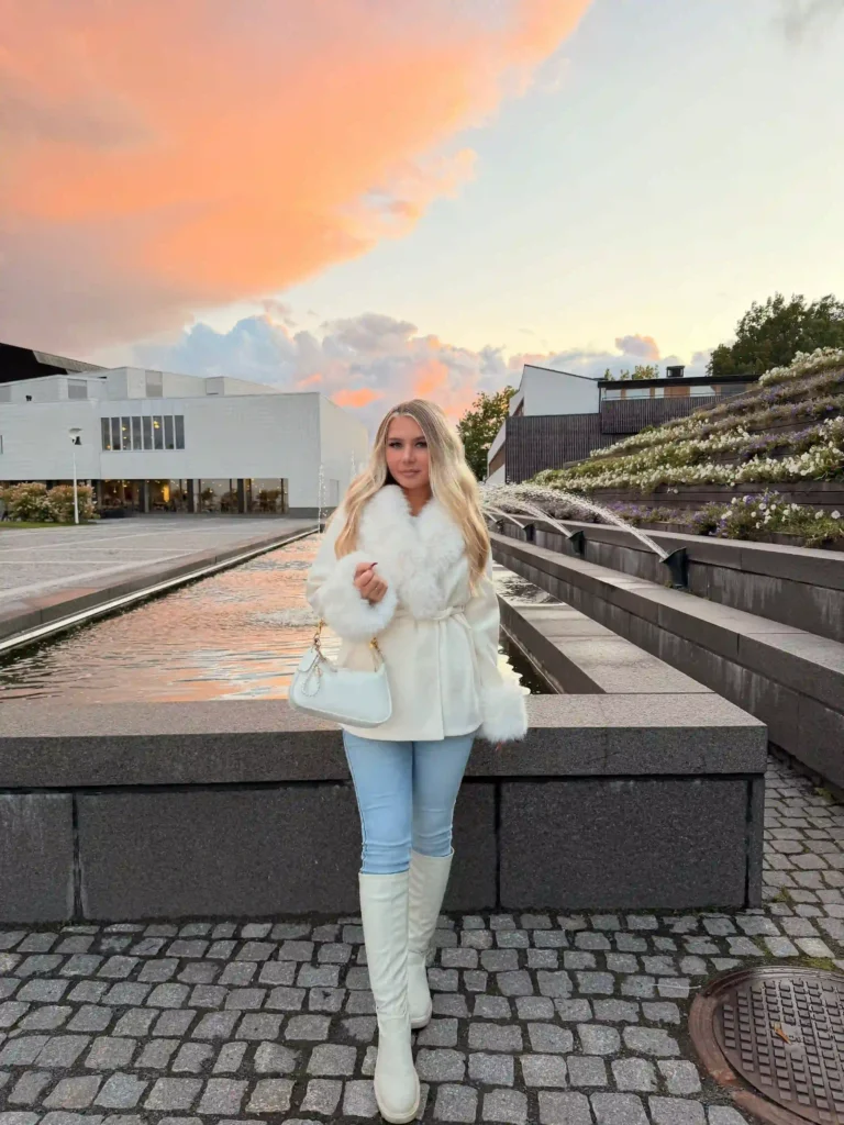 Fur-Trim Jacket and Skinny Jeans with White Knee-High Boots