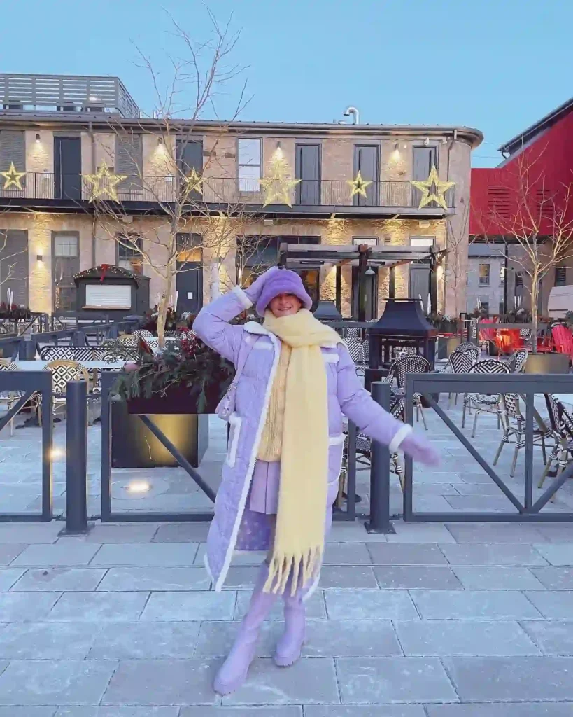 Long Puffer Coat and Lilac Skirt with Knee High Boots