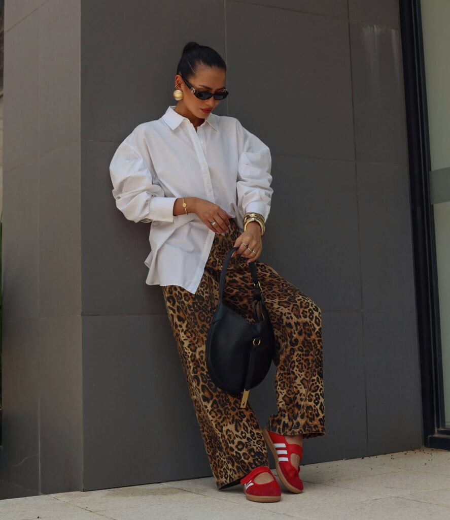 White Shirt with Wide-Leg Pants and Red Adidas Sambas