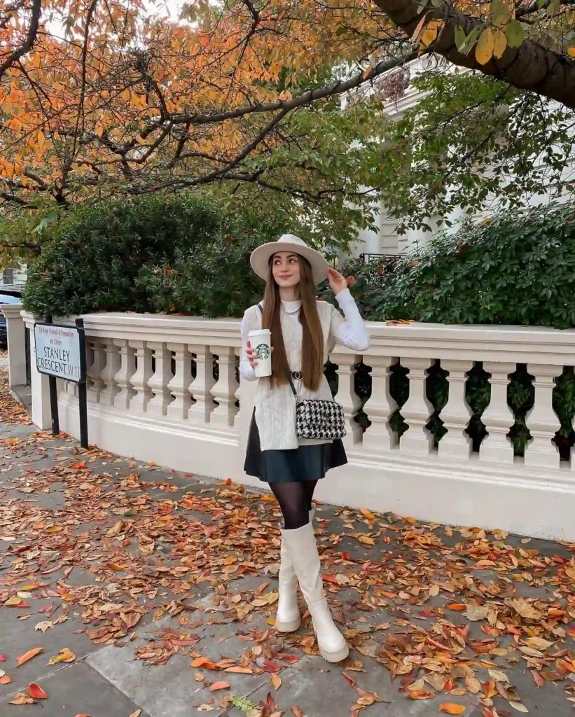 Cable Knit Vest with Black Skirt and Cream Knee High Boots